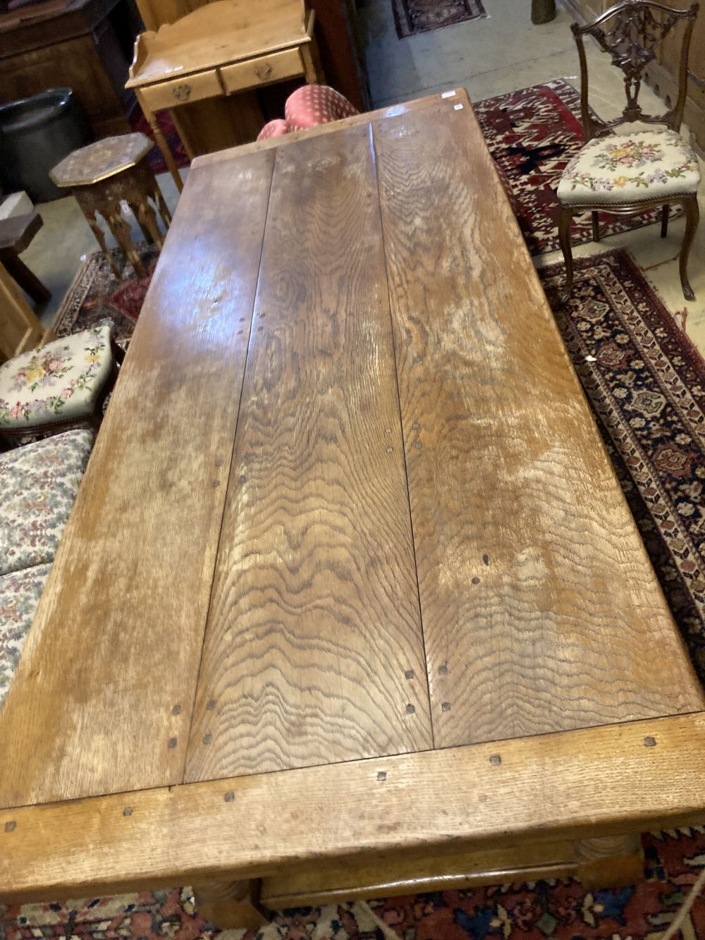 An 18th century style oak refectory dining table, 230 x 93cm height 77cm